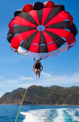 A person parasailing. A person parasailing.