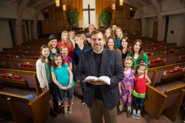 A pastor with his congregation. A pastor with his congregation.