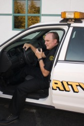 A patrolman sitting in his car. A patrolman sitting in his car.