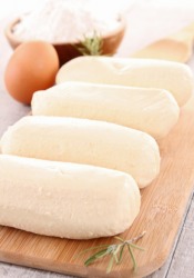 A row of quenelles waiting to be cooked. A row of quenelles waiting to be cooked.