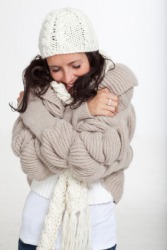 A woman quivers from the cold. A woman quivers from the cold.