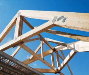 Wooden rafters of a house under construction. Wooden rafters of a house under construction.