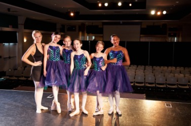 Teacher and students prepare for a ballet recital. Teacher and students prepare for a ballet recital.