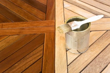 A wooden table being refinished. A wooden table being refinished.