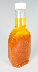 A bottle of salad dressing. A bottle of salad dressing.