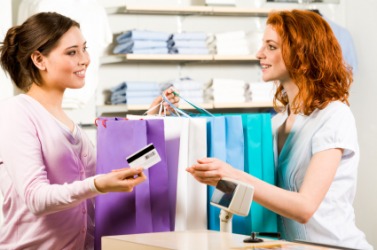 A saleslady assists a customer. A saleslady assists a customer.