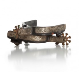 Tarnished silver spurs. Tarnished silver spurs.