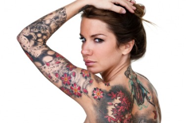 A woman displays her tattoos. A woman displays her tattoos.