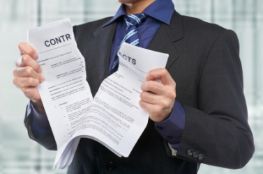 A man tears some papers. A man tears some papers.