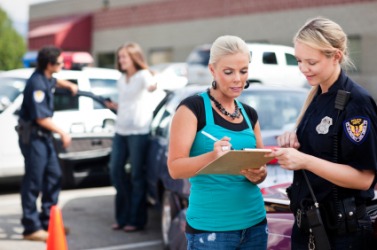 This woman tells a police officer what she knows. This woman tells a police officer what she knows.