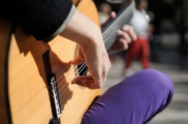 A musician plays unplugged. A musician plays unplugged.