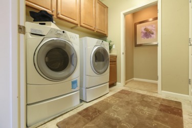 A utility room used for doing laundry. A utility room used for doing laundry.