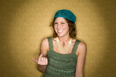 A woman beckoning with her finger. A woman beckoning with her finger.