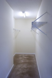 An empty walk-in closet. An empty walk-in closet.
