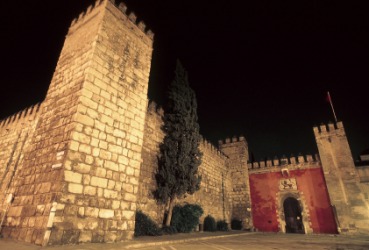 A night view of the Alcazar of Seville. A night view of the Alcazar of Seville.