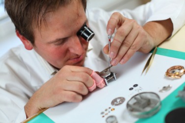 A watchmaker at work. A watchmaker at work.