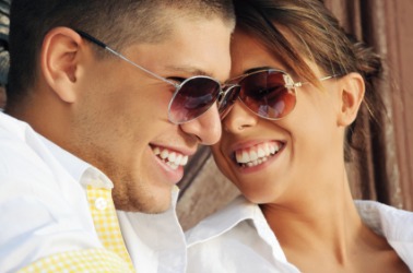A man and a woman wear sunglasses. A man and a woman wear sunglasses.