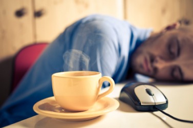 A man weary after a long day at work. A man weary after a long day at work.