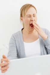 A woman yawns. A woman yawns.