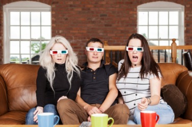 People wearing special glasses to watch a 3D movie. People wearing special glasses to watch a 3D movie.