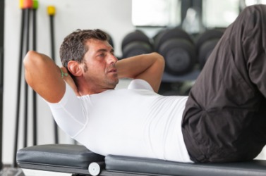 A man doing abdominal exercises. A man doing abdominal exercises.