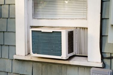An ac window unit. An ac window unit.
