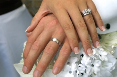 A bride and groom show their new belongings. A bride and groom show their new belongings.