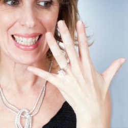 A woman shows off her bling. A woman shows off her bling.
