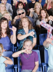 A crowd says boo to the performance. A crowd says boo to the performance.