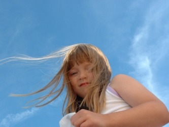 A girl's hair blows in the breeze. A girl's hair blows in the breeze.