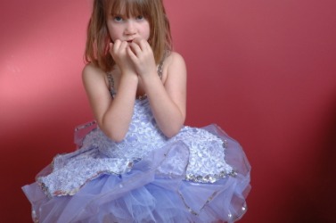 A little girl experiences butterflies before her performance. A little girl experiences butterflies before her performance.