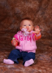 A baby waves bye bye A baby waves bye bye