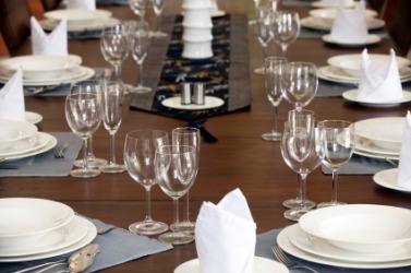 A table set for a decorous luncheon. A table set for a decorous luncheon.