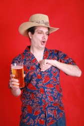 A man belching after a drink of beer. A man belching after a drink of beer.