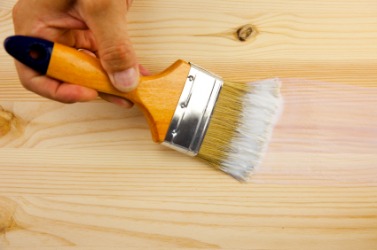 Lacquer being applied to a wood floor. Lacquer being applied to a wood floor.