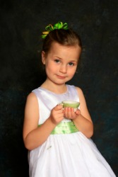 A little girl behaving in a very ladylike manner. A little girl behaving in a very ladylike manner.