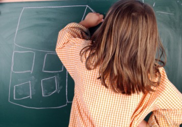 This little girl is left-handed. This little girl is left-handed.