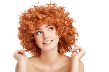 A woman with kinky hair. A woman with kinky hair.