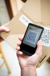 A QR code on a smartphone. A QR code on a smartphone.