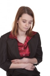 This woman is feeling queasy. This woman is feeling queasy.