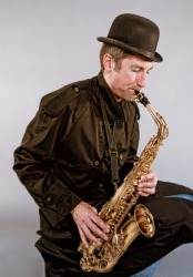 A man playing a sax. A man playing a sax.