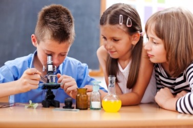 Young students in science class. Young students in science class.