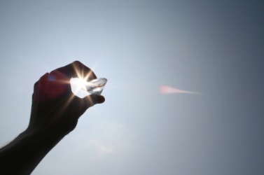 A diamond scintillates in the sun. A diamond scintillates in the sun.