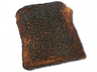 A piece of scorched toast. A piece of scorched toast.
