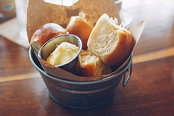 bowl of bread rolls and butter bowl of bread rolls and butter